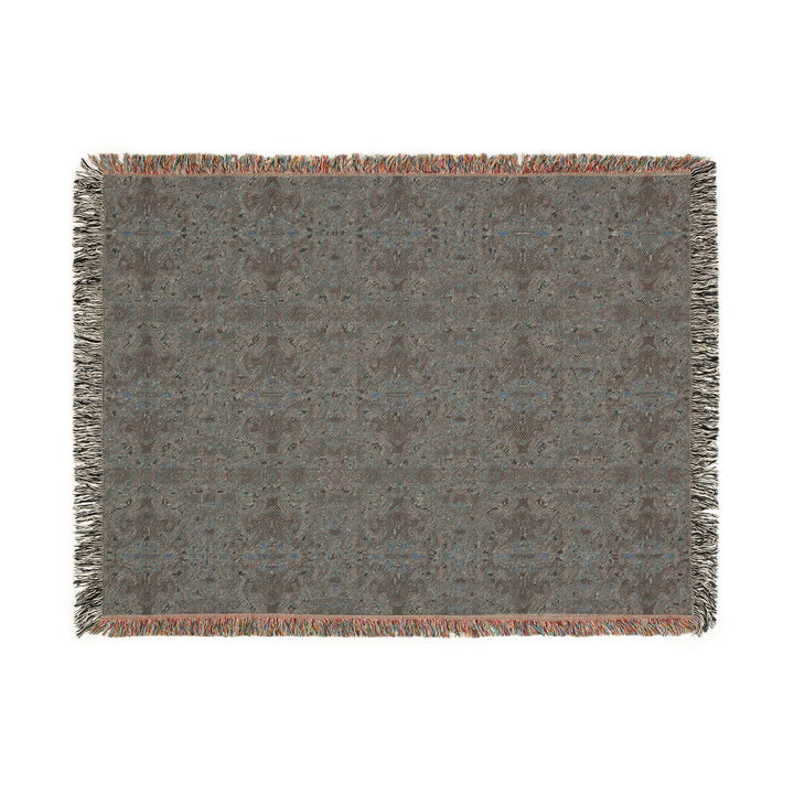 Textured blanket with a geometric pattern on a white background