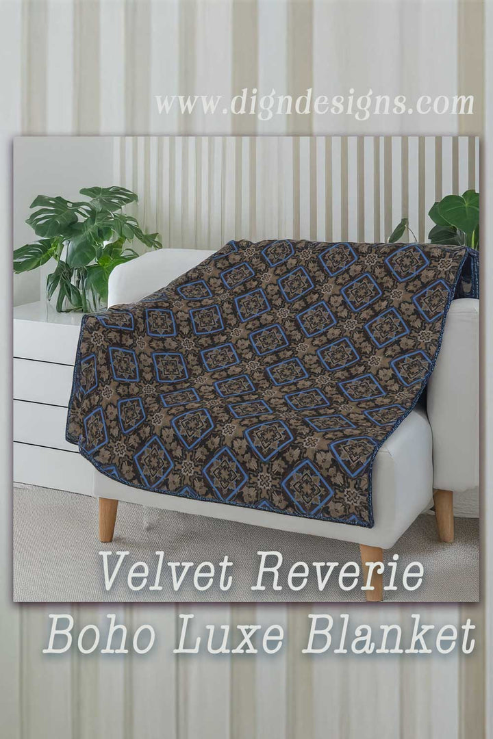 Velvet Reverie Boho Luxe Blanket draped over a white sofa with a neutral background.