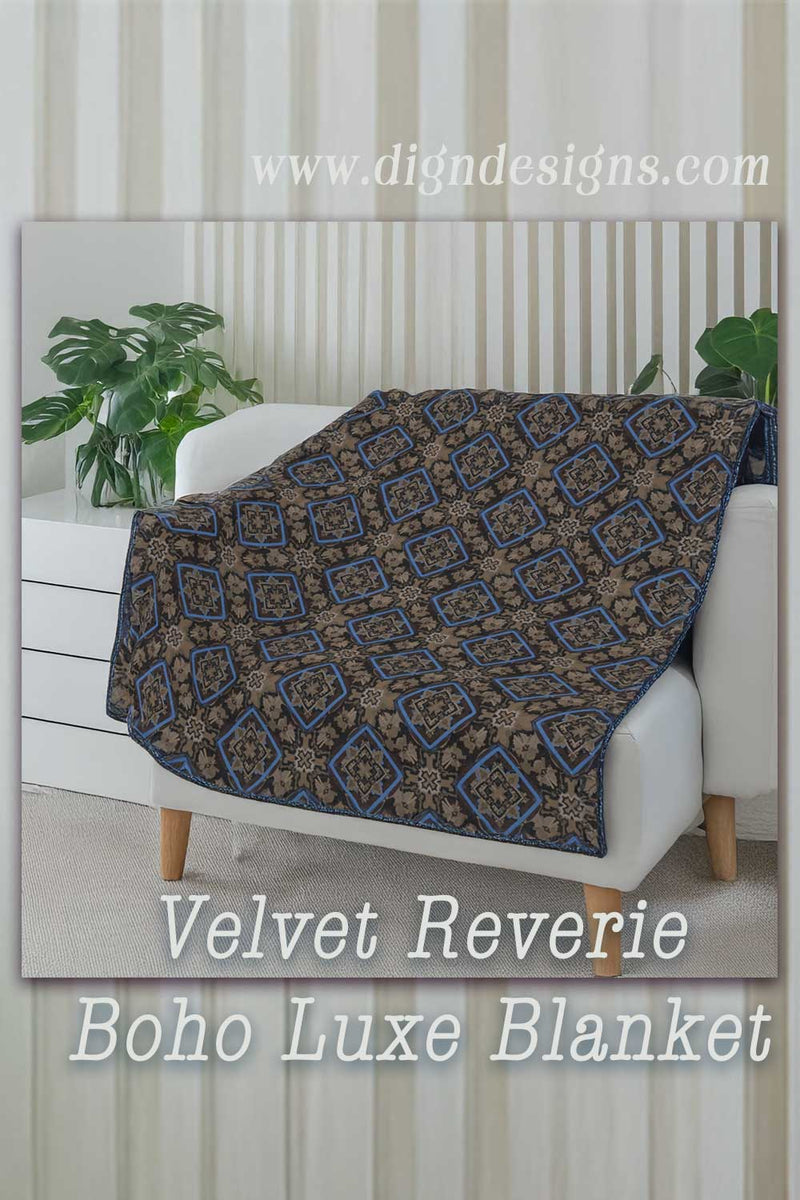 Velvet Reverie Boho Luxe Blanket draped over a white sofa with a neutral background.