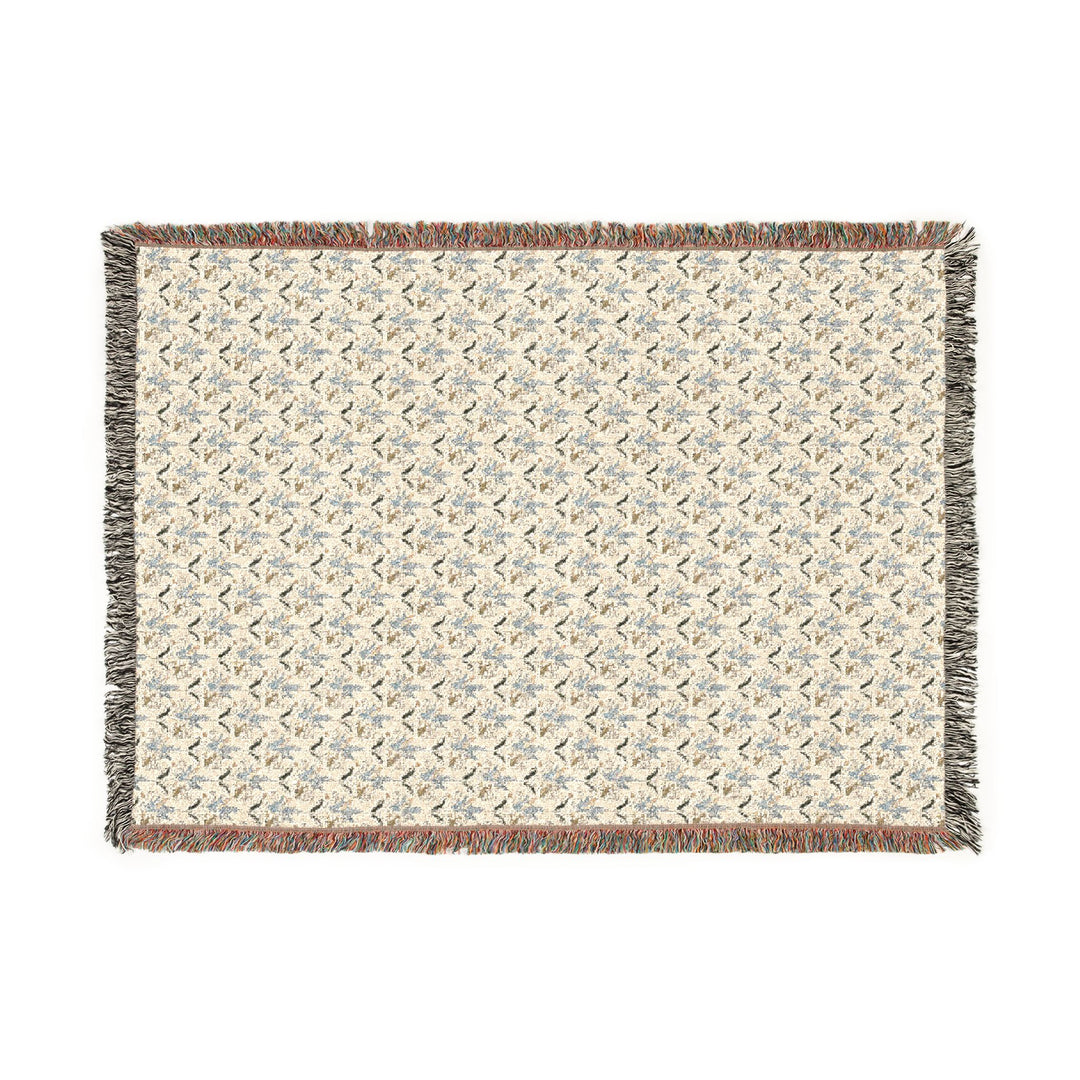Woven blanket with a geometric pattern on a white background