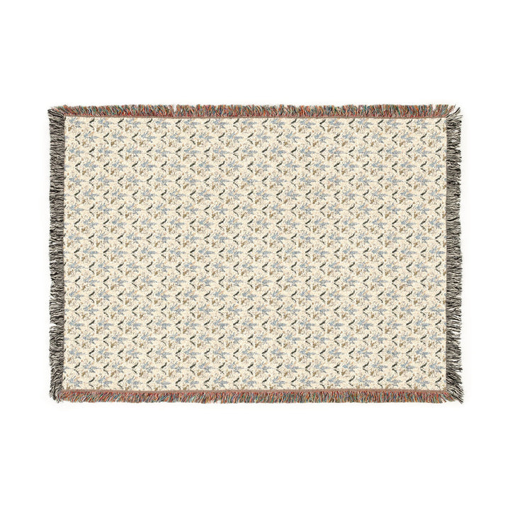 Woven blanket with a geometric pattern on a white background