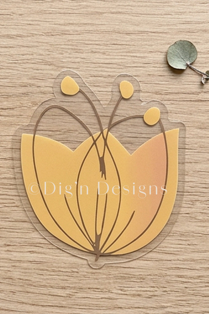 Yellow flower-shaped object on a wooden surface with Dig&