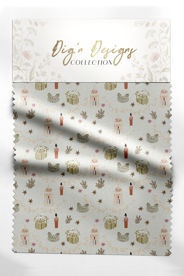 Candlelit Keepsakes Christmas fabric swatch with wrapped gifts, glowing candles, lanterns and gold stars on warm cream, from the Hearth &amp; Holly Collection by Dig&
