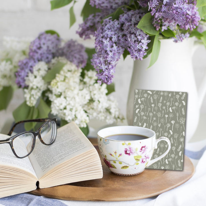 extra wide white traced flowers bookmark on bedside tray with book and drink