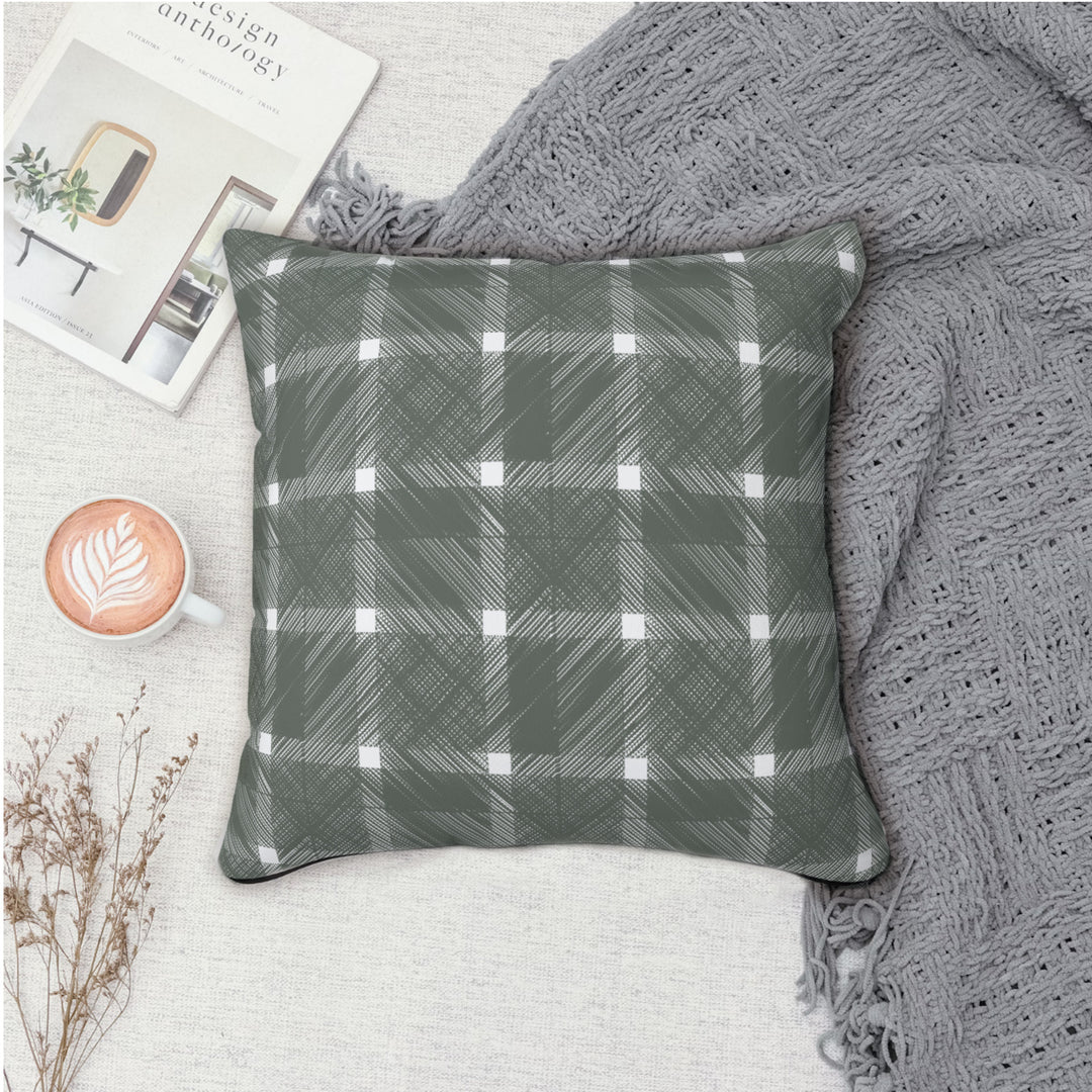 Geometric Crosshatch Design in Green and White - Plaid Spun Polyester Square Pillow On blanket for display