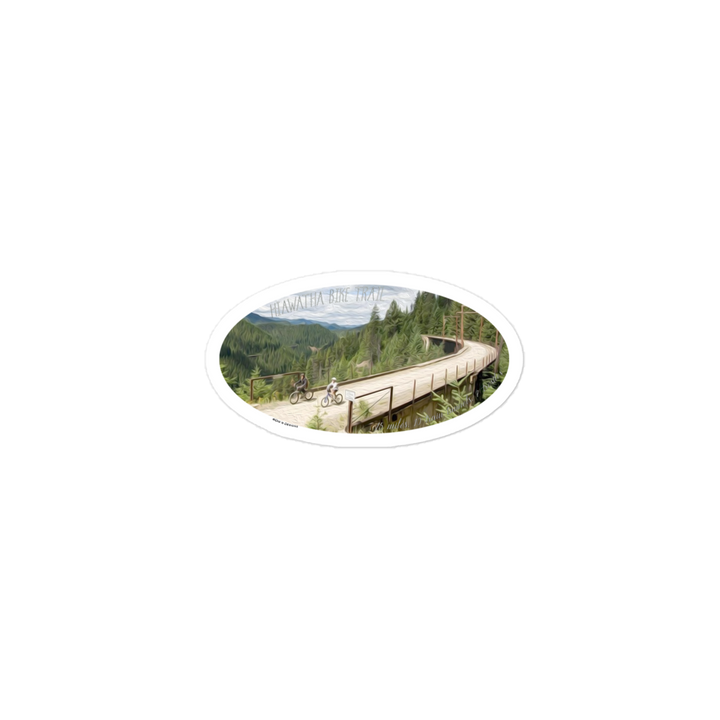 this sticker is an oil painting/picture of part of the Hiawatha trail.