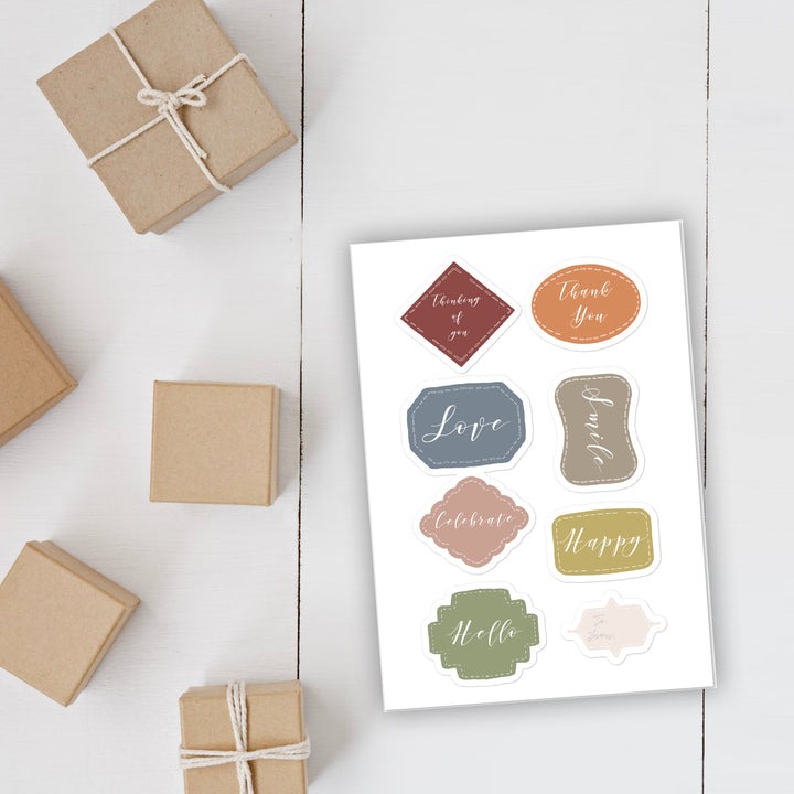 Package tag sticker sheet on display on table with gifts