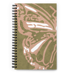 Picture of a green notebook with half of a coral colored butterfly with detailed wings.