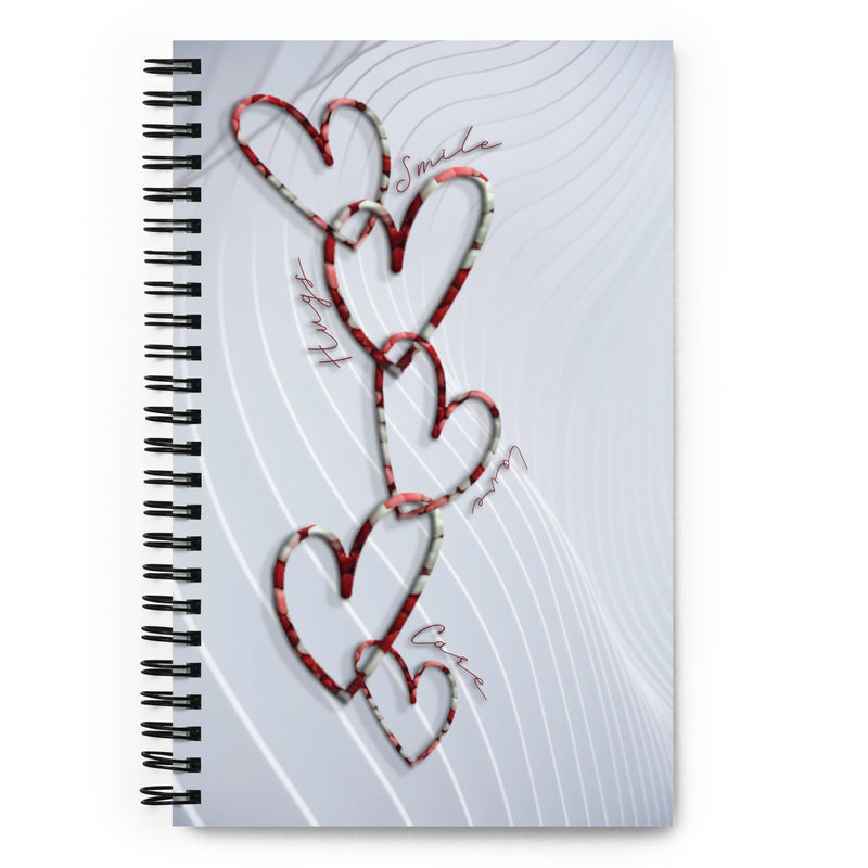 Chain link hearts with words around the design as the pattern on a notebook