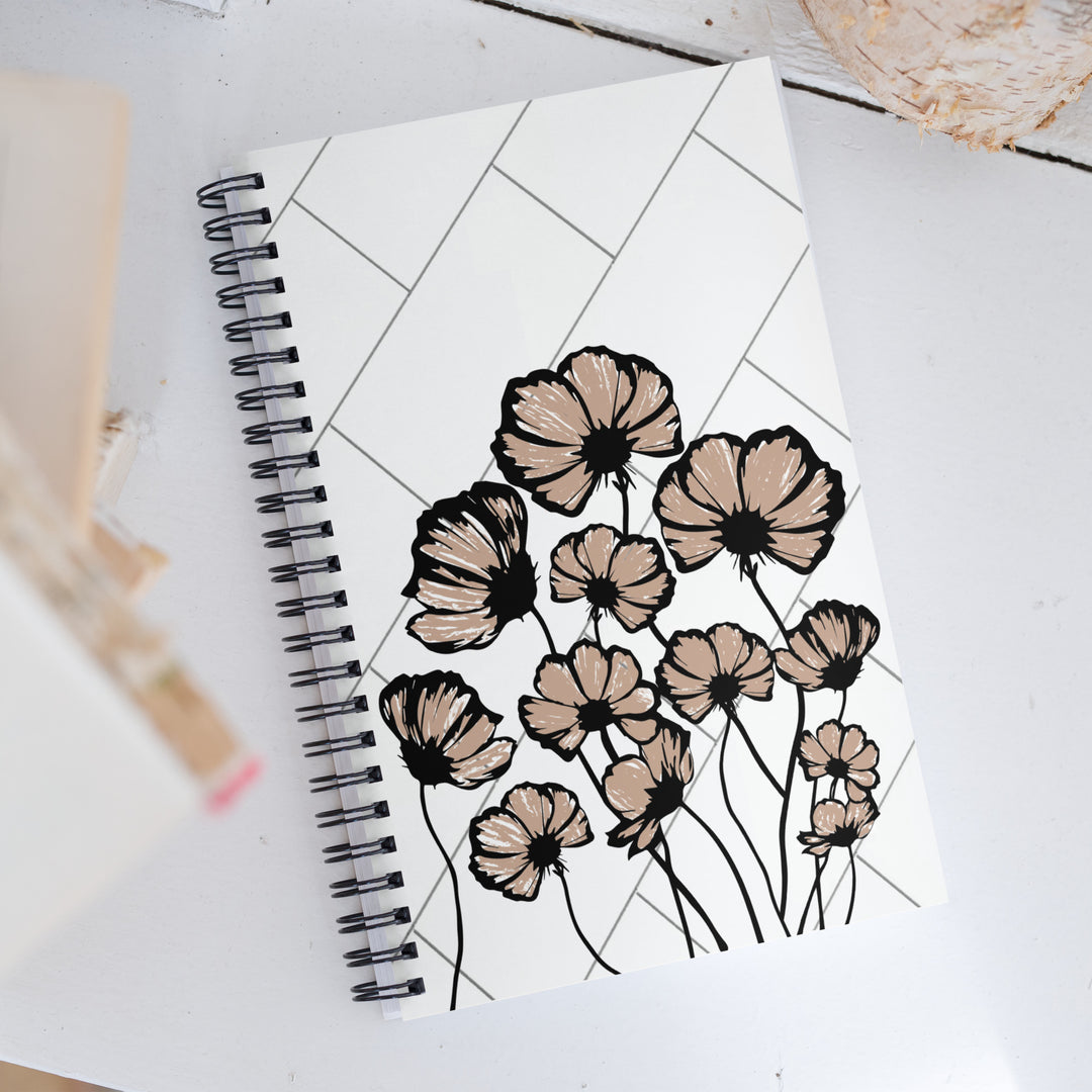 Notebook or journal with black traced flowers that are painted in light brown