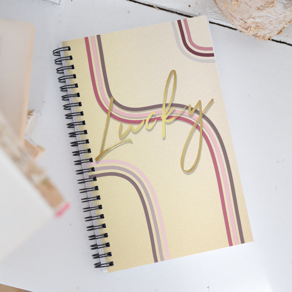 Lucky golden notebook product display laying on a table