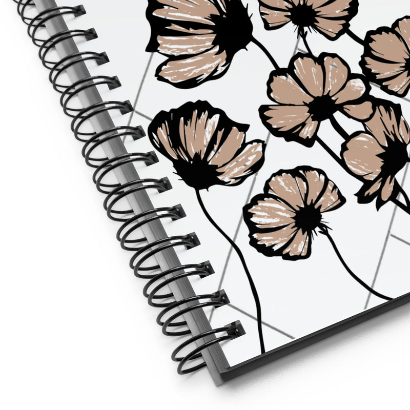 Notebook or journal with black traced flowers that are painted in light brown