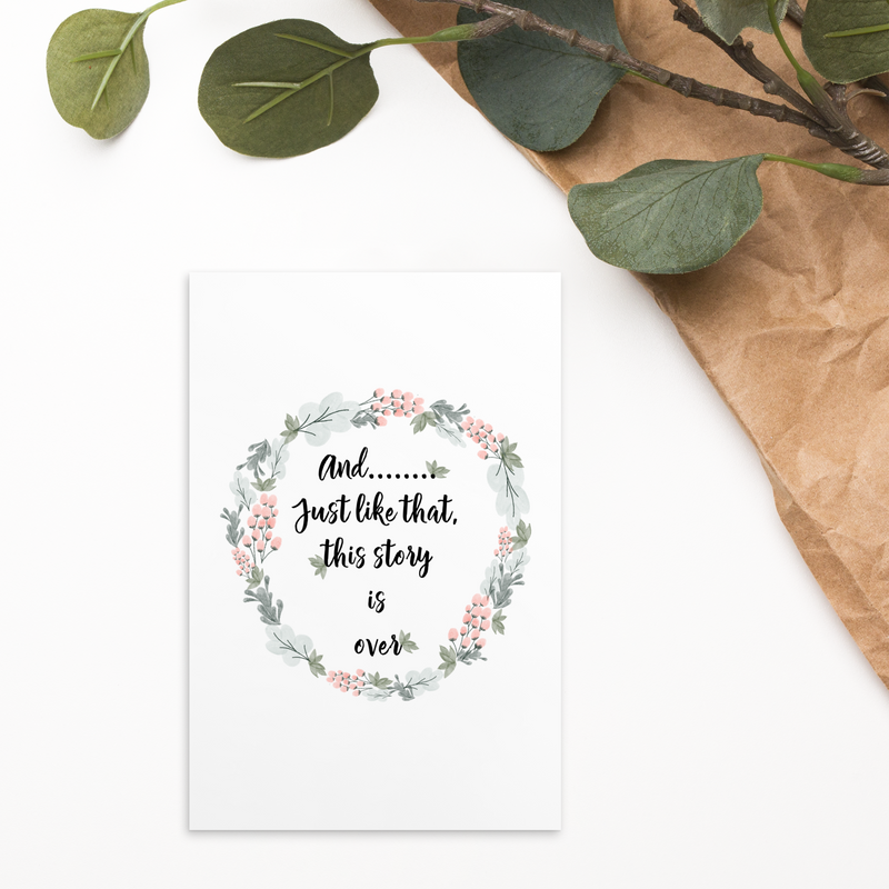 picture of the extra wide floral book mark with the quote on it sitting on a table with greenery and decor surrounding it