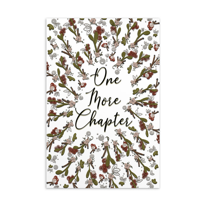 A bookmark with the words "one more chapter" written on it with flowers surrounding it 