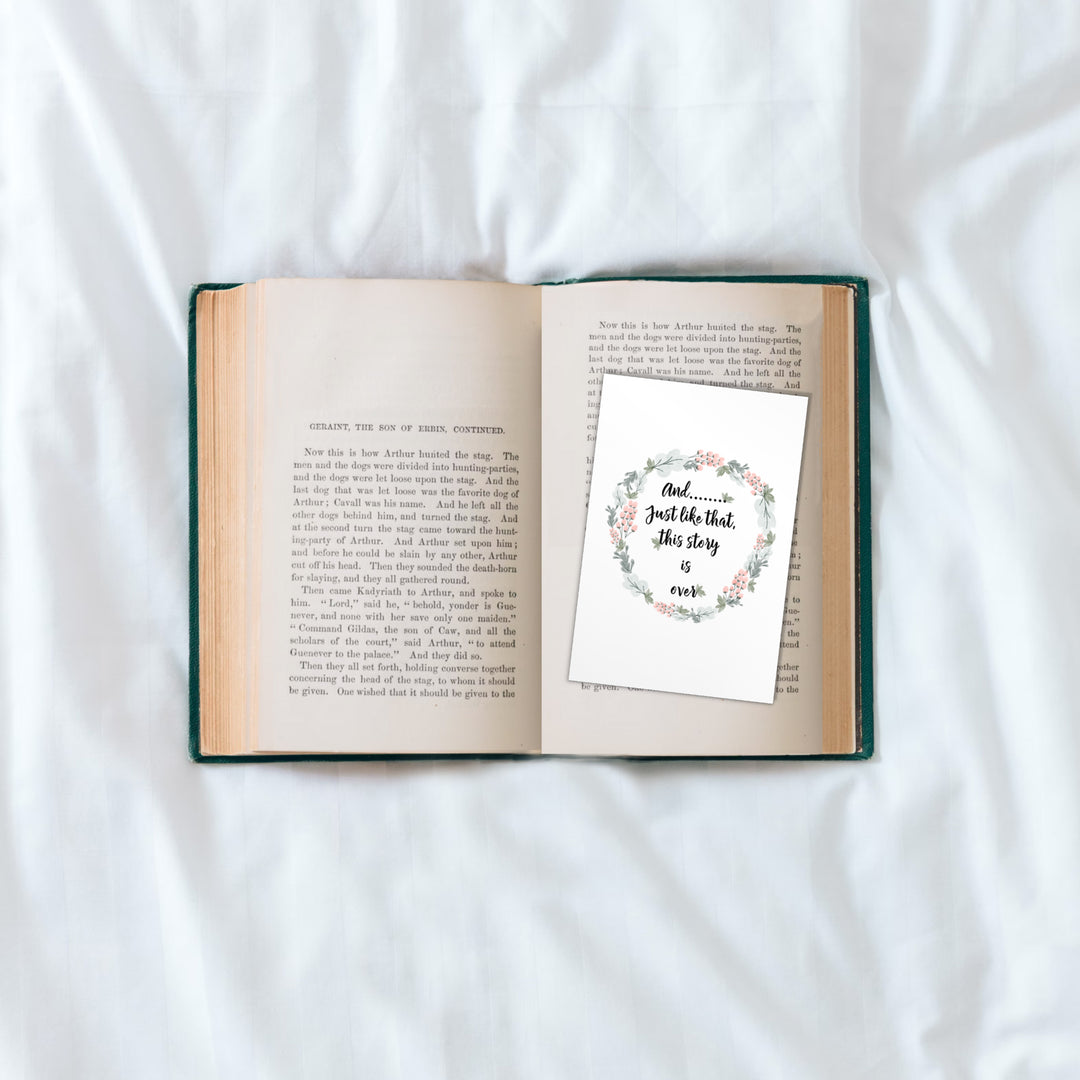 open book with extra wide bookmark with cute quote and floral wring around the quote