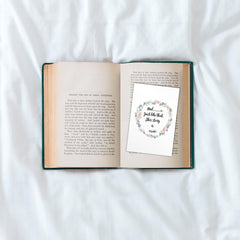 open book with extra wide bookmark with cute quote and floral wring around the quote