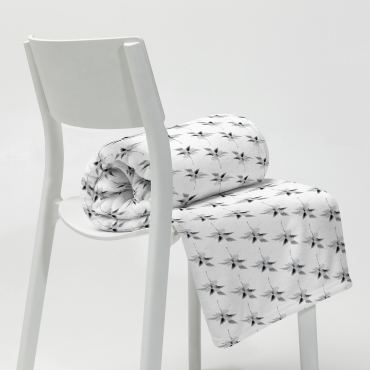 This is a picture of a snowflower in pattern form on a throw blanket