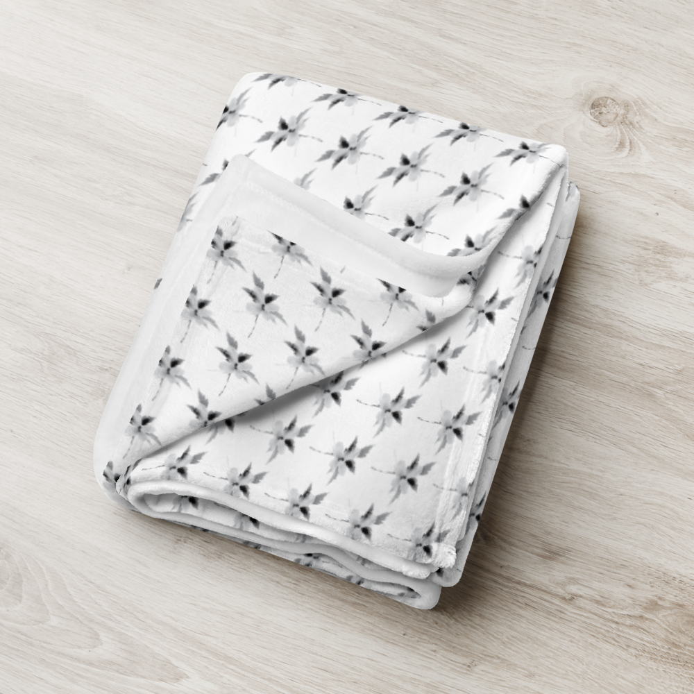 This is a picture of a snowflower in pattern form on a throw blanket