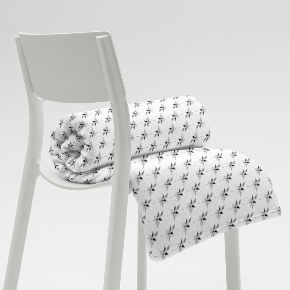 This is a picture of a snowflower in pattern form on a throw blanket