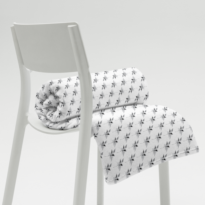 This is a picture of a snowflower in pattern form on a throw blanket