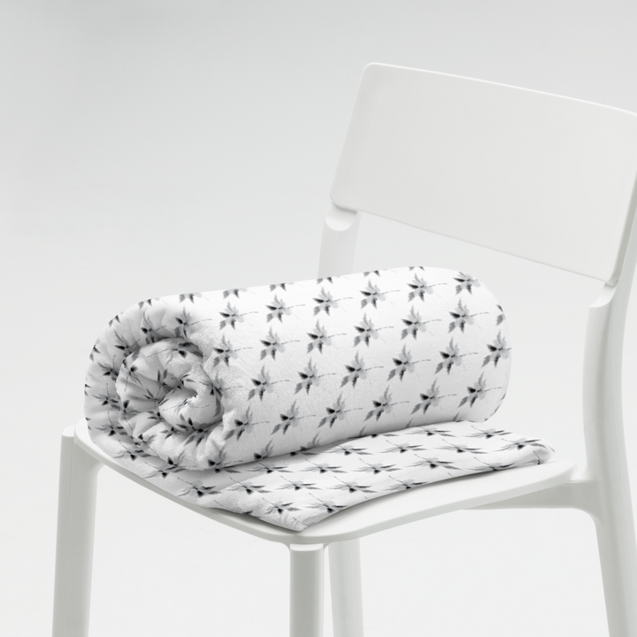 This is a picture of a snowflower in pattern form on a throw blanket