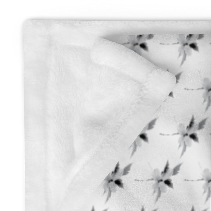 This is a picture of a snowflower in pattern form on a throw blanket