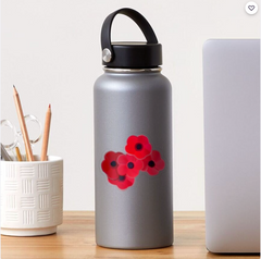 5 poppy flowers Grouped together on a water bottle. 