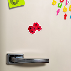 5 poppy flowers Grouped together placed on a fridge