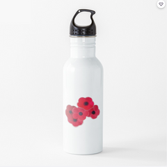 5 poppy flowers Grouped together placed on a water bottle