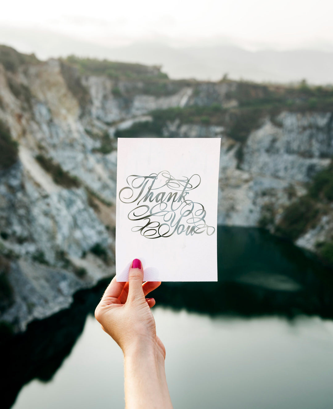Product display of Thanks you cut out solid lines and broken lines for cutting machines.  This product display shows someone who used this file to create a thank you card with the words thank you cut out of the paper to create a void in the paper. 
