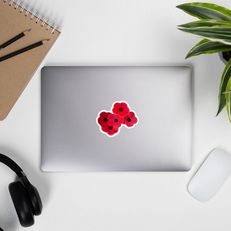 5 poppy flowers Grouped together placed on a laptop