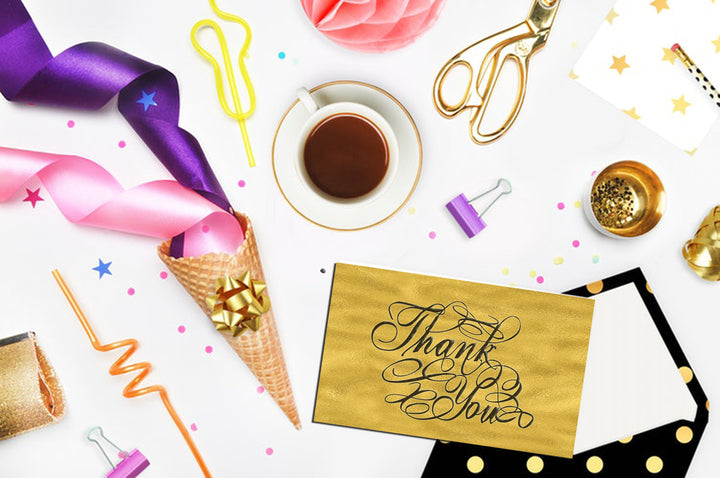 Product display of Thanks you cut out solid lines and broken lines for cutting machines. This product display is showing how someone used the file to create a gold card with the words thank you displayed on the front of the card.