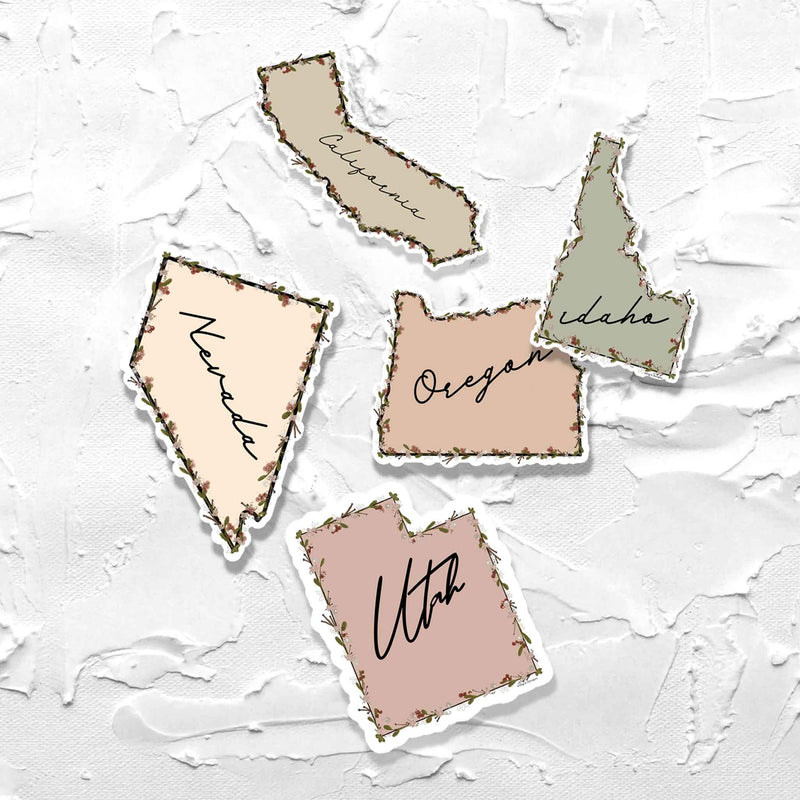 a collection of 5 states in their sticker form.